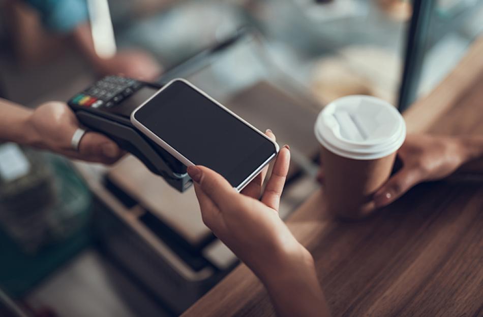 picture of someone paying with their phone